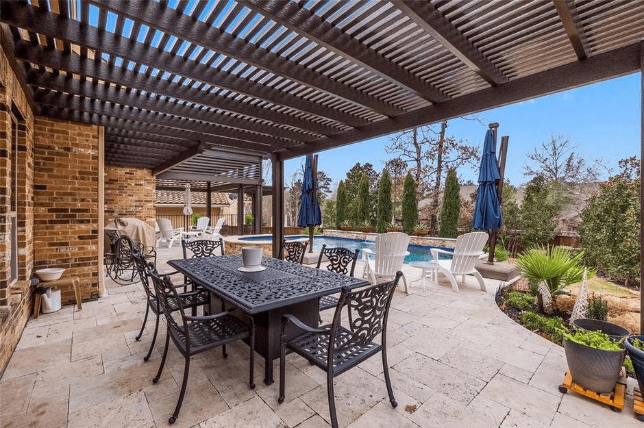 Pergola in a backyard by a pool in Conroe, TX