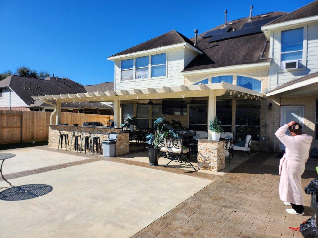 Covered patio built in Houston backyard attached to house